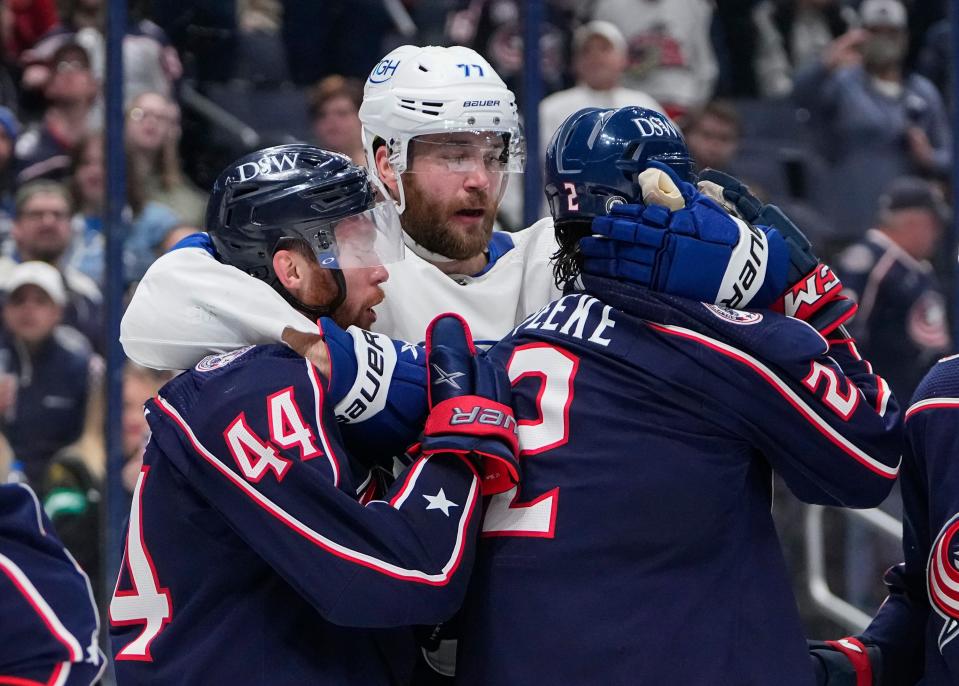 Tampa Bay Lightning defenseman Victor Hedman (77) wraps up Columbus Blue Jackets defenseman Vladislav Gavrikov (44) and defenseman Andrew Peeke (2) during a scuffle in front of the Columbus Blue Jackets net during the second period of the NHL game at Nationwide Arena in Columbus on April 28, 2022.