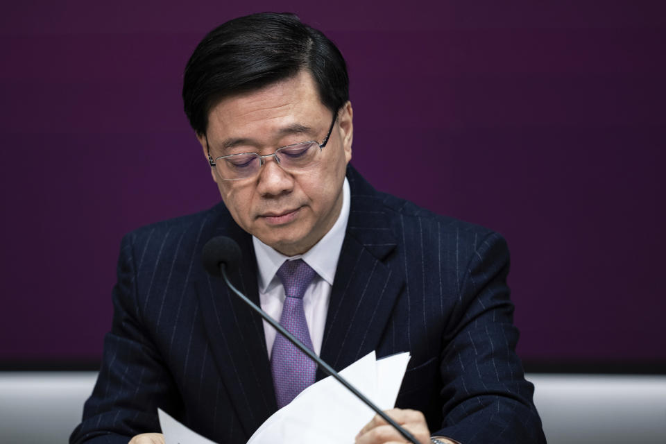 Hong Kong Chief Executive John Lee attends a press conference at government headquarters in Hong Kong, Tuesday, Jan. 30, 2024. (AP Photo/Louise Delmotte)