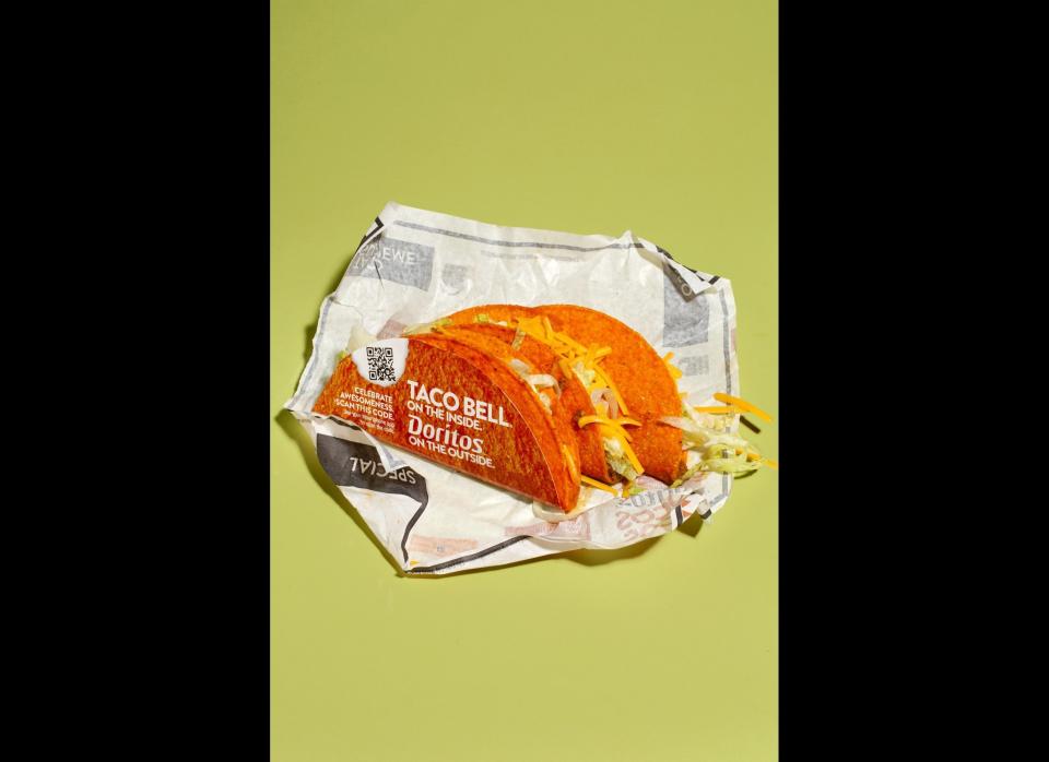 <strong>The Method:</strong> The one that started it all uses a proprietary taco shell-shaped Doritos chip as its wrapper, and comes swathed in a special cardboard holder to prevent Doritos powder from coating eaters' hands.    <strong>The Verdict:</strong> Very positive reviews all around; most agreed that the tacos had been improved by the extra salt and savoriness of the Doritos shell. The biggest complaint was that there wasn't enough Doritos flavor -- it seemed as if the seasoning had been tamped down vis-a-vis the normal chips. To solve this problem, we tried adding more Doritos in the middle of the taco. It didn't help.