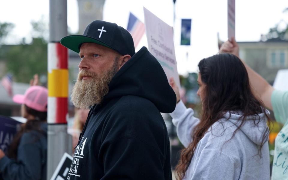 Shaun O’Reilly joins anti-abortion advocates outside First Concern Pregnancy Resource Center during an open house on June 17, 2023, in Marlborough, Massachusetts.