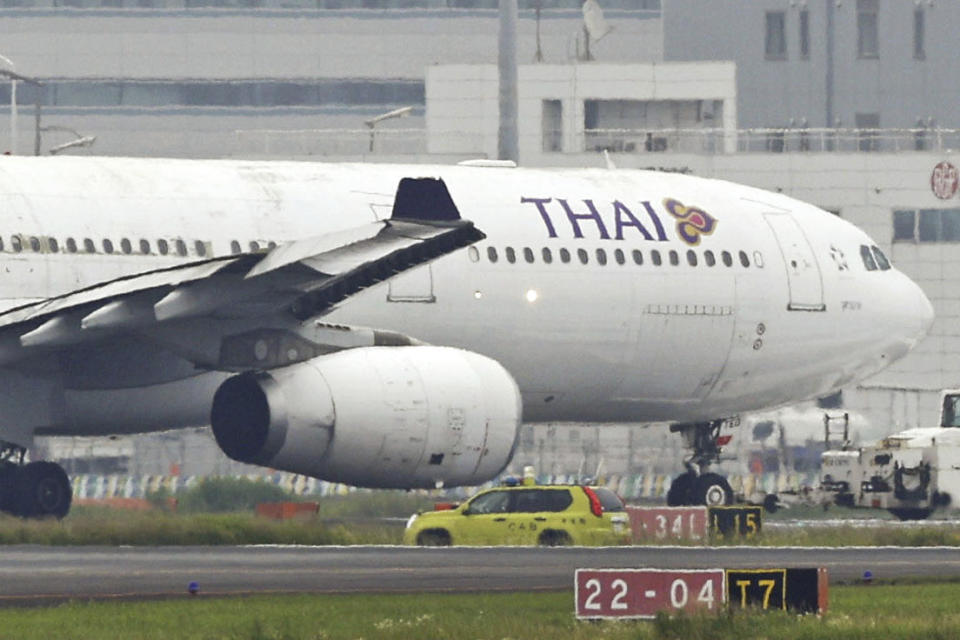 A Thai Airways International airplane is seen on a runway after contacting an Eva Airways plane, at Haneda airport in Tokyo, Saturday, June 10, 2023. (Kyodo News via AP)