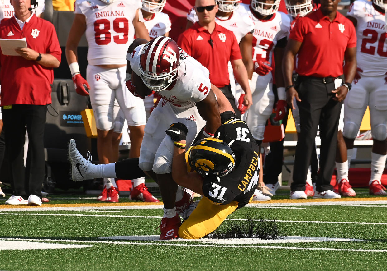 IOWA CITY, IA - SEPTEMBER 04: Iowa MIKE Jack Campbell (31) tackles Indiana running back Stephan Carr (5) during a college football game between the Indiana Hoosiers and the Iowa Hawkeyes on September 04, 2021, at Kinnick Stadium, Iowa City, IA. (Photo by Keith Gillett/Icon Sportswire via Getty Images),