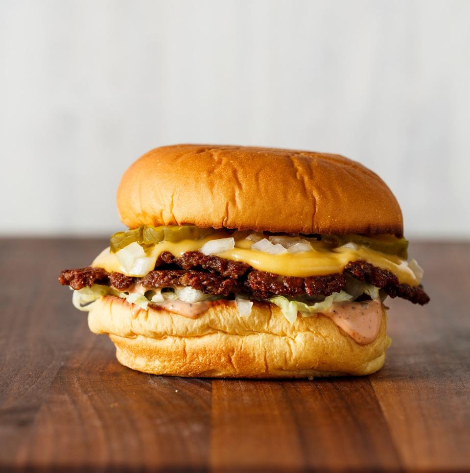 The Double Smashies Burger is made with plant-based meat to taste like a fast-food-style patty, pressed thin and topped with a savory sauce.