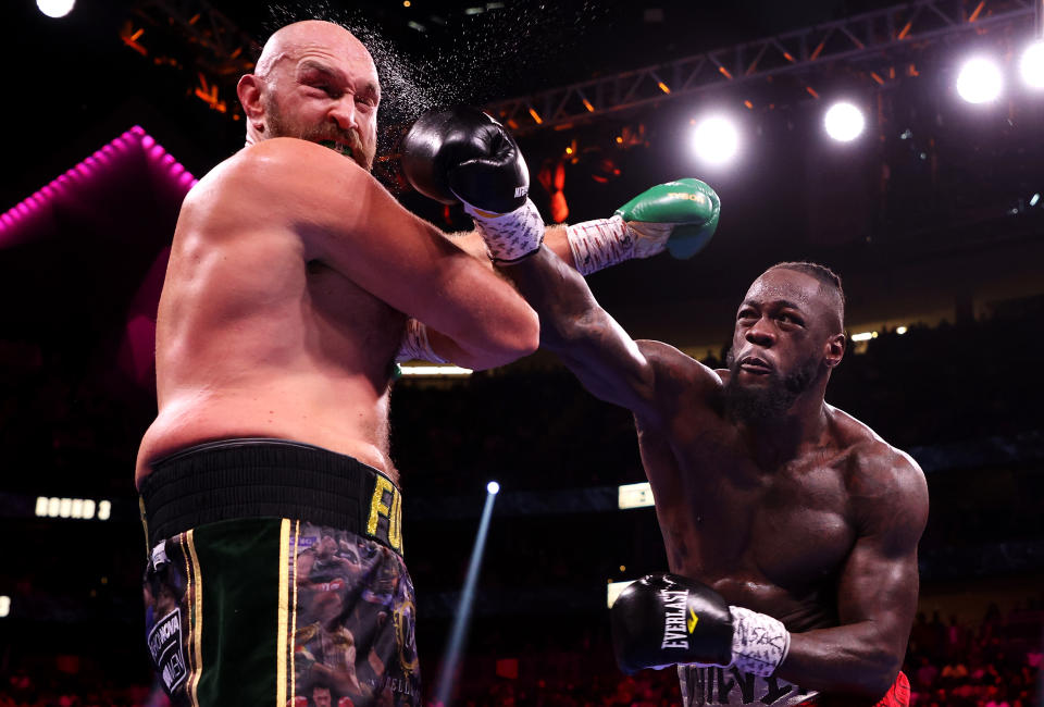 LAS VEGAS, NEVADA - OCTOBER 09: Deontay Wilder (R) punches Tyson Fury during their WBC heavyweight title fight at T-Mobile Arena on October 09, 2021 in Las Vegas, Nevada. (Photo by Al Bello/Getty Images)