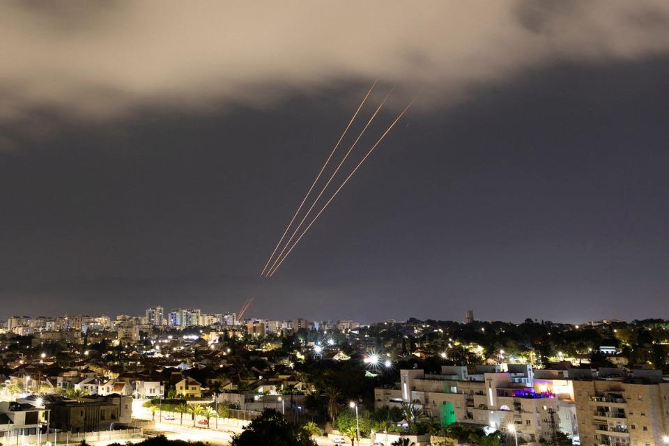 An anti-missile system operates after Iran launched drones and missiles towards Israel, as seen from Ashkelon (Reuters)