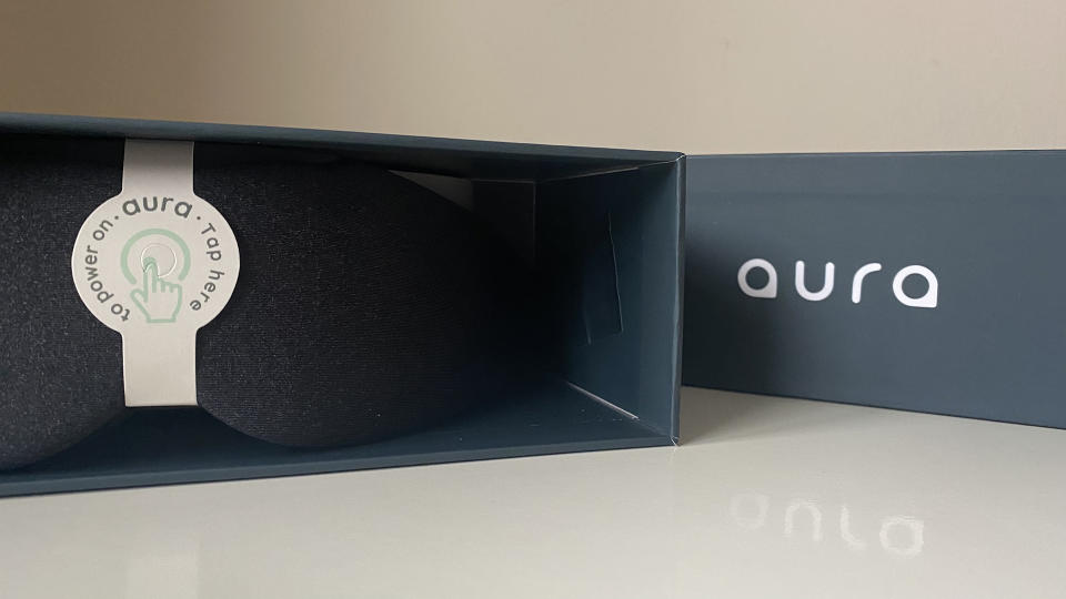 The Aura Smart sleep mask in the box it came in