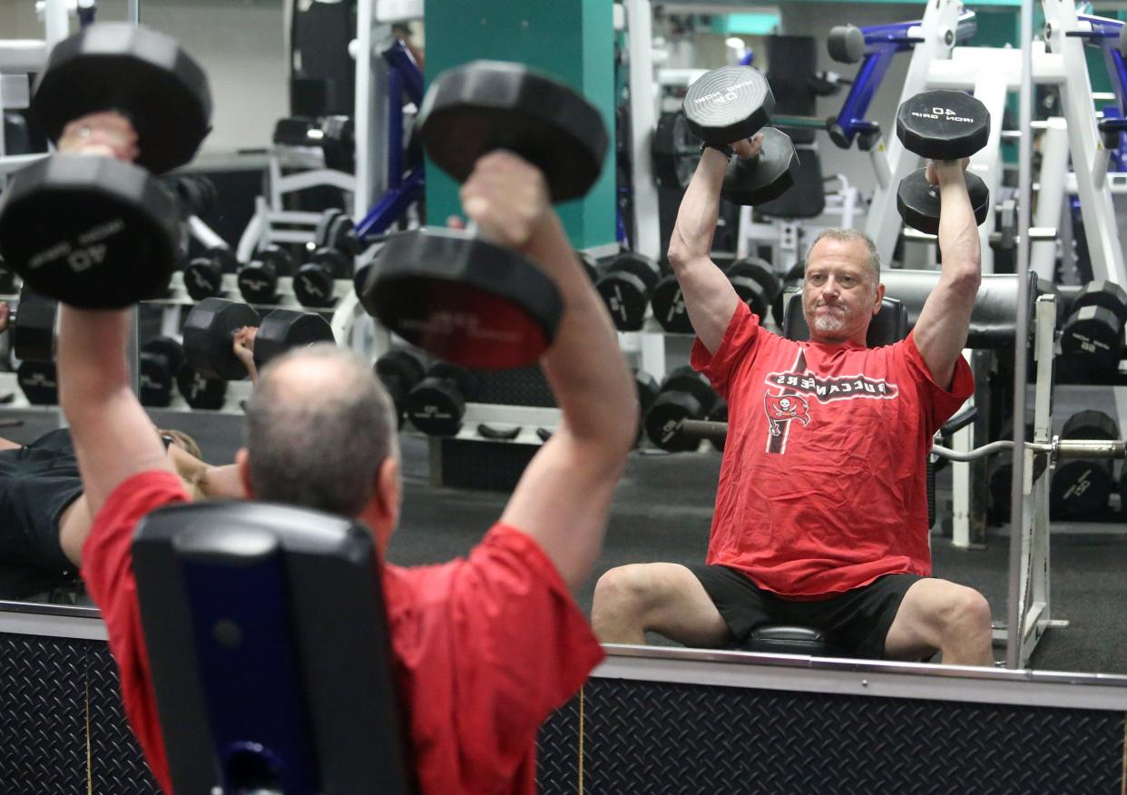 Bill Davis works out at the YMCA in North Canton on Wednesday, June 29, 2022. The facility reopened today after being closed for six days due to a pool leak.