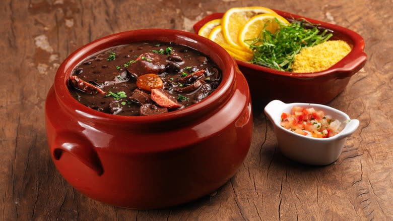 Feijoada in bowl with sides