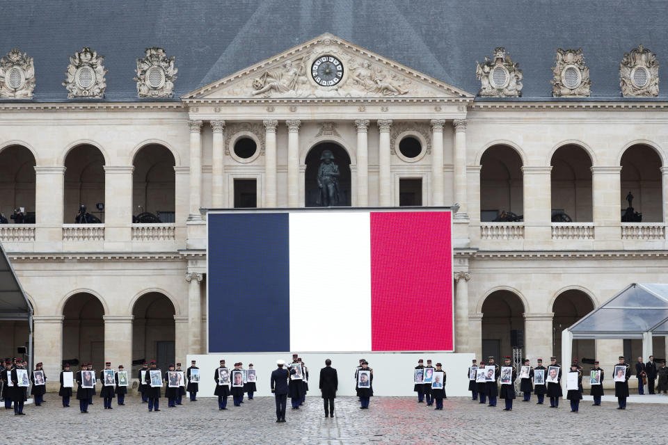 French President, center, attends a ceremony for the French victims of the Oct.7 2023 Hamas' attack, at the Invalides monument, Wednesday, Feb.7, 2024. France is paying tribute to French victims of Hamas' Oct. 7 attack, in a national ceremony led by President Emmanuel Macron four months after the deadly assault in Israel that killed some 1,200 people, mostly civilians, and saw around 250 abducted.(Gonzalo Fuentes/Pool via AP)