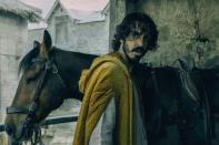This image released by A24 shows Dev Patel in a scene from "The Green Knight". (A24 via AP)