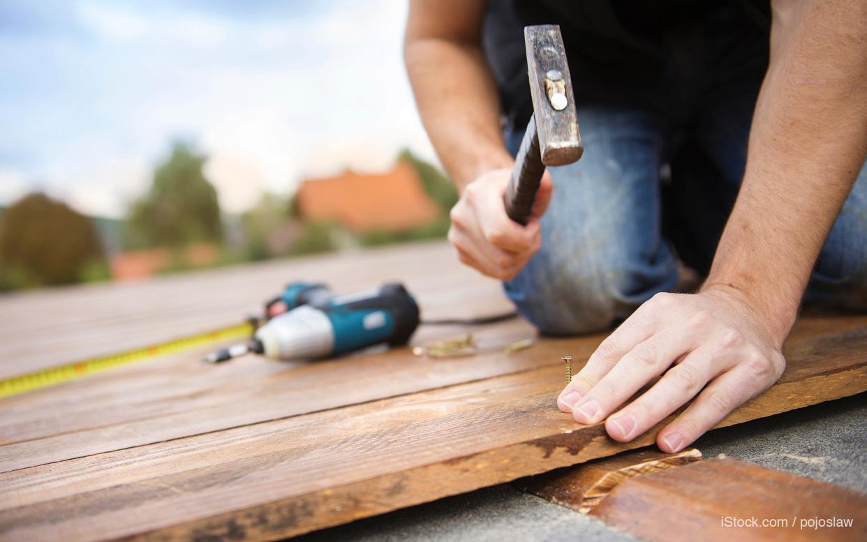 man building a deck