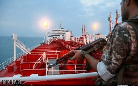 A member of the Iranian National Guard on board the Stena Impero - Credit: AFP