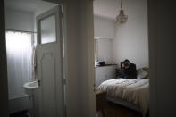 Keila Lozano aims her camera from inside her bedroom during a government-ordered lockdown to curb the spread of the new coronavirus in Buenos Aires, Argentina, Tuesday, June 23, 2020. Lozano, a model, costume designer, and photographer, said she stopped racing around and started slowing down her life-work rhythm during the quarantine, and that it would have been impossible before the lockdown. (AP Photo/Natacha Pisarenko)