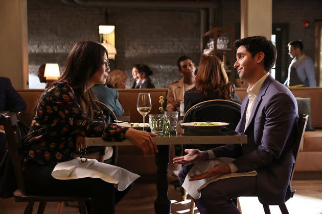 Jimmy (Paul Downs) power-lunching with rival manager Janet Stone (Ming-Na Wen) in Season Two of HBO Max's 