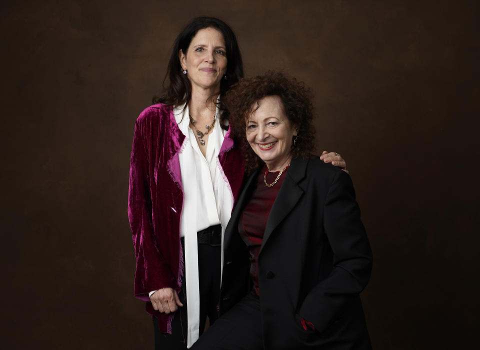 Laura Poitras, left, and Nancy Goldin pose for a portrait at the 95th Academy Awards Nominees Luncheon on Monday, Feb. 13, 2023, at the Beverly Hilton Hotel in Beverly Hills, Calif. (AP Photo/Chris Pizzello)