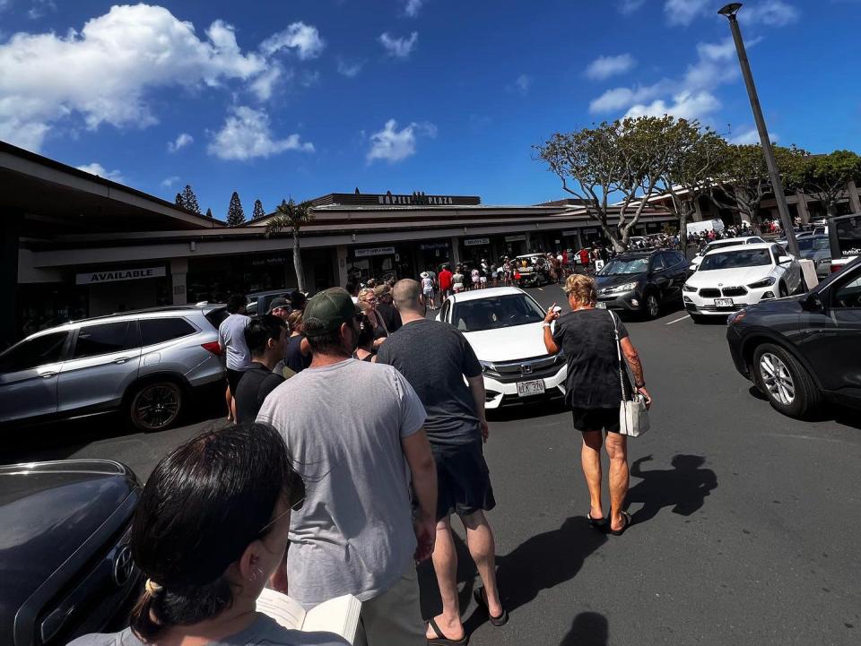 People in line at a grocery market in Maui.