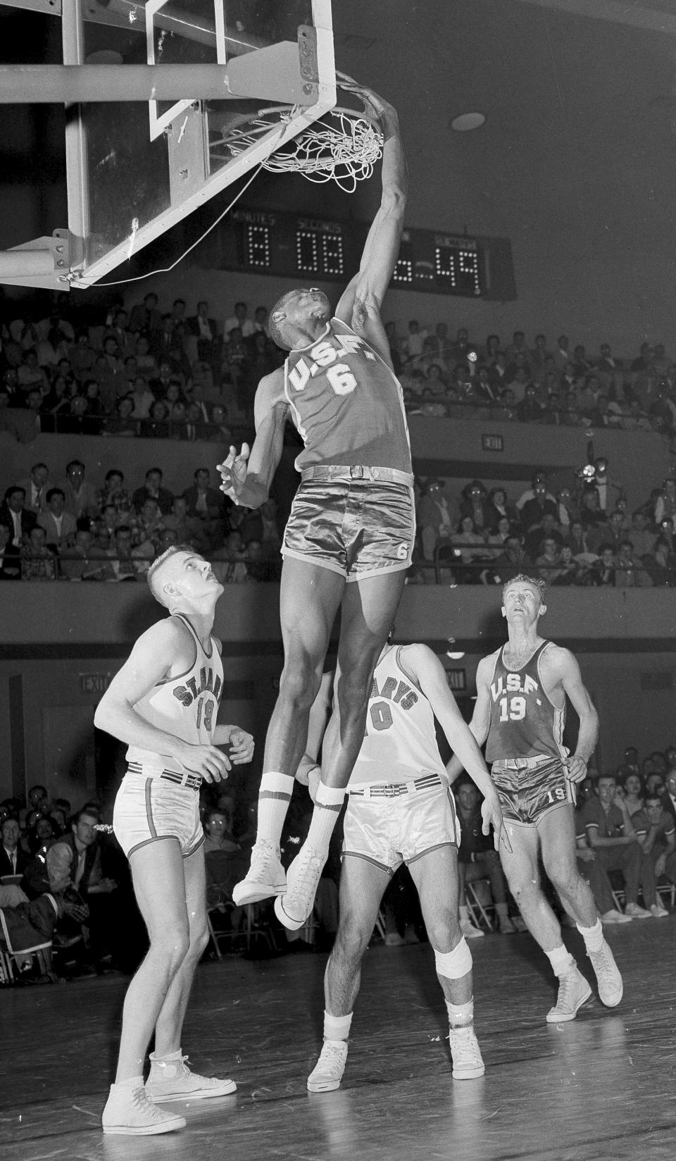 FILE - University of San Francisco's star center Bill Russell scores against St. Mary's College in Richmond, Calif., Feb. 23, 1956. San Francisco won, 74-63. (AP Photo)