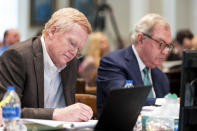 Alex Murdaugh, left, jots down notes during his double murder trial at the Colleton County Courthouse in Walterboro, S.C., on Monday, Feb. 6, 2023. (Jeff Blake/The State via AP, Pool)