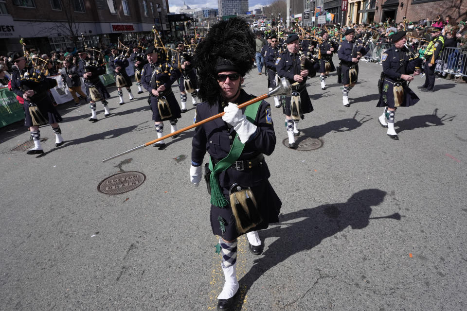 Members of the Boston Police Gaelic Column of Pipes and Drums march in the St. Patrick's Day parade, Sunday, March 17, 2024, in Boston's South Boston neighborhood. (AP Photo/Steven Senne)