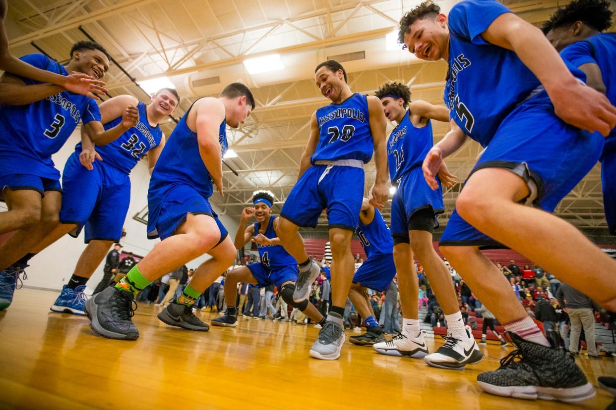 Cassopolis players dance after winning the Brandywine vs. Cassopolis boys district championship basketball game at Watervliet High School Friday, March 9, 2018. Tribune Photo/MICHAEL CATERINA