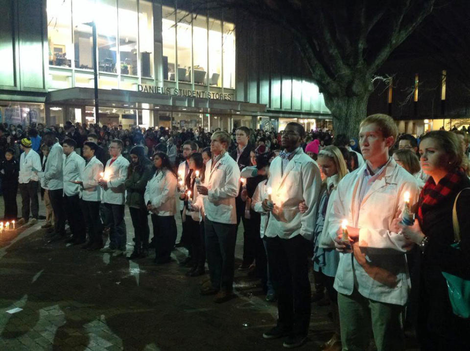 A line of a UNC dental students take part in a vigil at UNC on Wednesday Feb. 11, 2015. 