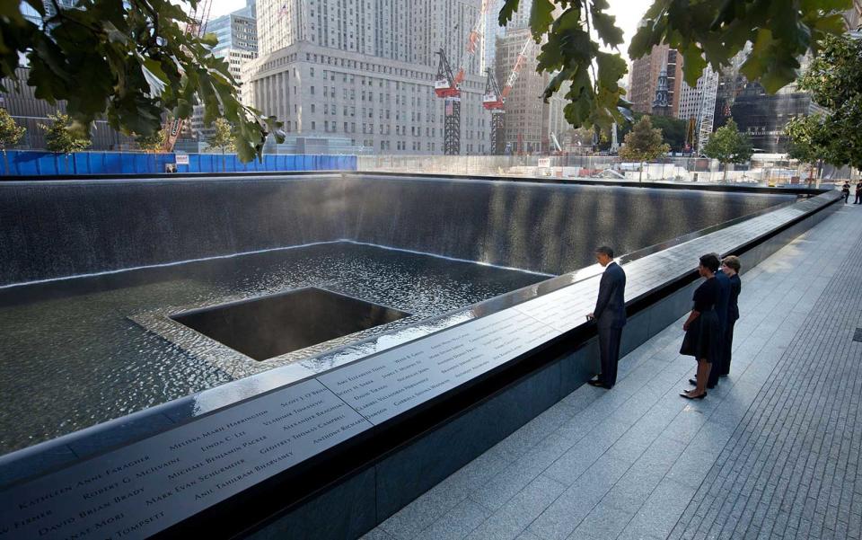 <p>Obama takes a moment of reflection at the National September 11 Memorial and Museum.</p>