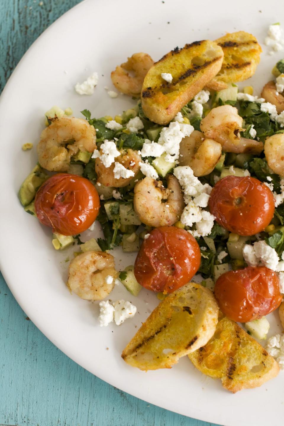 In this image taken on May 13, 2013, Caribbean grilled shrimp salad is shown served on a plate in Concord, N.H. (AP Photo/Matthew Mead)