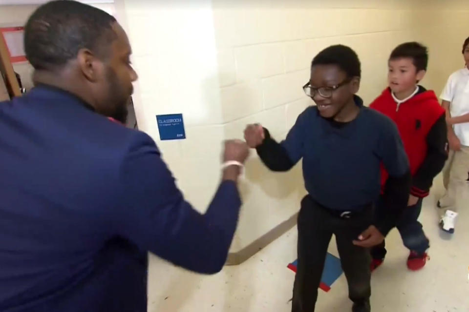 Personalised: Barry White Jr greets his pupils in different fashion before they enter class at a school in North Carolina: NBC