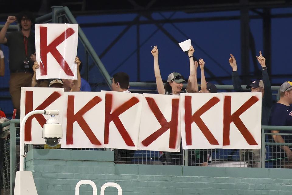 Fans mark another strikeout by Boston Red Sox starting pitcher Chris Sale during the fifth inning of the team's baseball game against the Detroit Tigers, Friday, Aug. 11, 2023, in Boston. (AP Photo/Michael Dwyer)