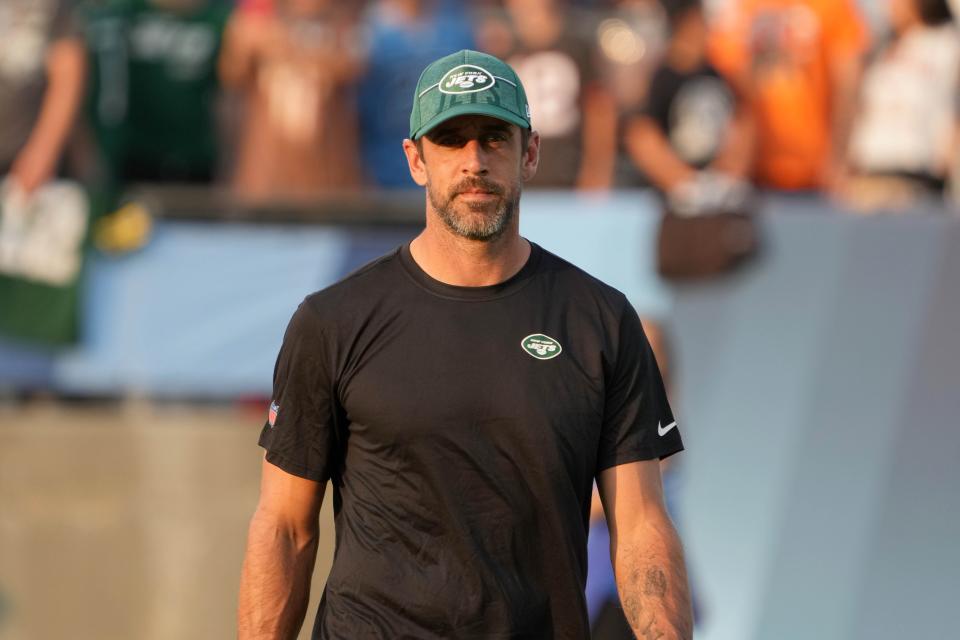 Aug 3, 2023; Canton, Ohio, USA; New York Jets quarterback Aaron Rodgers (8) watches from the sidelines during the first half against the Cleveland Browns at Tom Benson Hall of Fame Stadium. Mandatory Credit: Kirby Lee-USA TODAY Sports