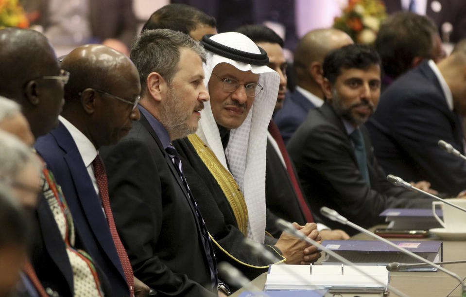 Prince Abdulaziz bin Salman Al-Saud, center, Minister of Energy of Saudi Arabia looks prior to the start of a meeting of the Organization of the Petroleum Exporting Countries, OPEC, at their headquarters in Vienna, Austria, Thursday, Dec. 5, 2019. (AP Photo/Ronald Zak)