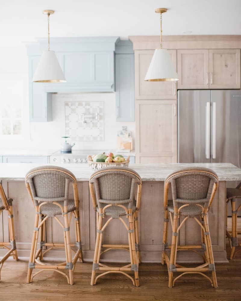 Kitchen with pale blue and whitewashed wood cabinets