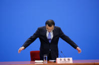 Chinese Premier Li Keqiang arrives for a news conference following the closing session of the National People's Congress (NPC) at the Great Hall of the People in Beijing, China March 15, 2019. REUTERS/Jason Lee