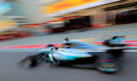 Formula One - F1 - Russian Grand Prix - Sochi, Russia - 29/04/17 - Mercedes Formula One driver Lewis Hamilton of Britain drives in the pit lane during the qualifying session. REUTERS/Yuri Kochetkov/Pool