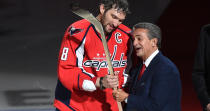 <p>Washington Capitals owner Ted Leonsis presents Alex Ovechkin (8) with a commemorative stick celebrating his 500th goal on January 14, 2016 in Washington, DC. (Jonathan Newton / The Washington Post via Getty Images) </p>