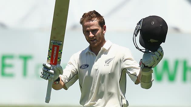 Williamson raises his bat after his first innings ton. Image: Getty