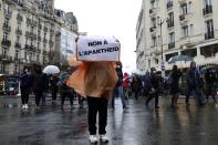 FILE Demonstrators march in opposition to vaccine pass and vaccinations to protect against COVID-19 in Paris, France, Saturday, Jan. 8, 2022. The run-up to the April election comes in a context of mounting violence targeting elected officials in France, with holders of public officers targeted for their politics and by opponents of COVID-19 vaccinations restrictions. (AP Photo/Adrienne Surprenant, File)