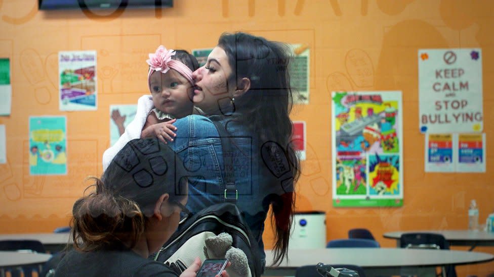 Helen, 16, arrives for classes with her daughter Jenine