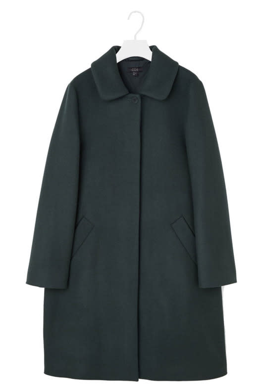 Wearing that same black coat will make every day feel like a miserable Groundhog Day, so give it up. This deep-green version by COS is well under $200, and subdued enough to be work-appropriate.