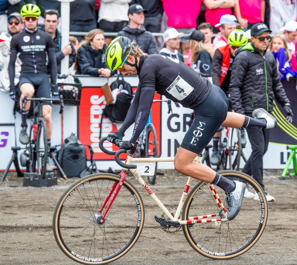 Sigma Phi Epsilon's Drew Gavette makes the exchange during the 72nd running of the Little 500 men's race at Bill Armstrong Stadium on Saturday, April 22, 2023.
