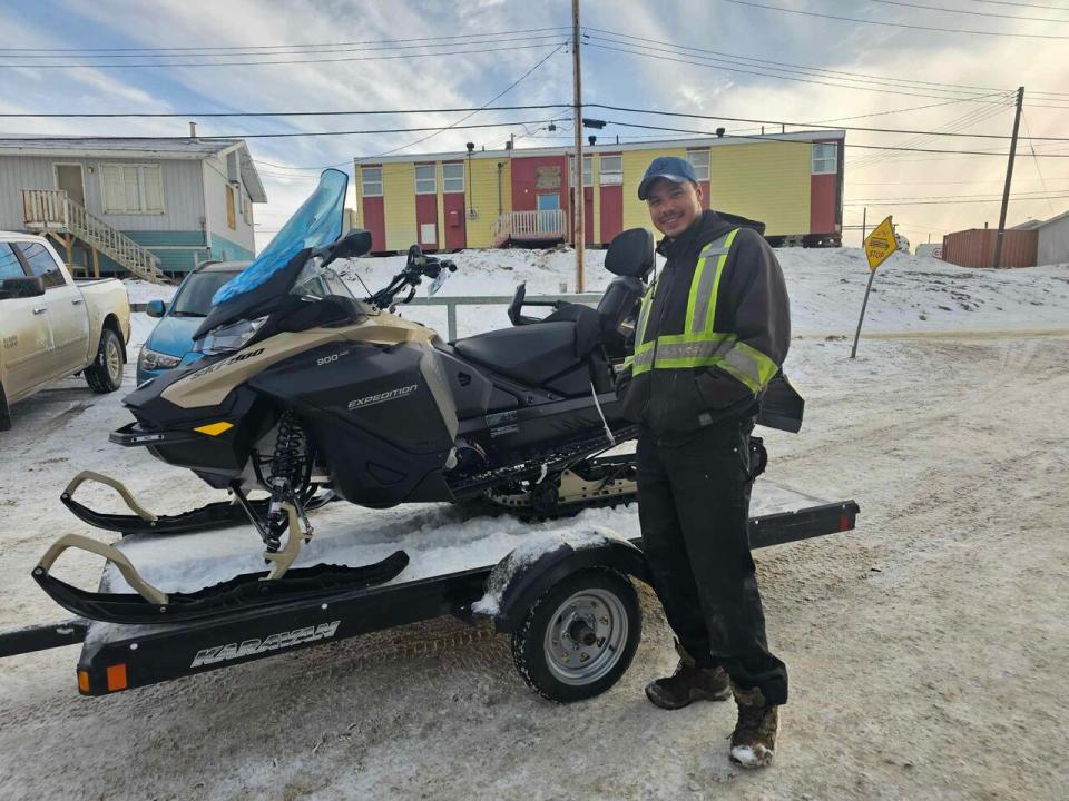 Mishal Pewatoalook, of Pond Inlet, survived falling through the ice and into water while hunting in late December. He lost his snowmobile, and has started a fundraising page to help replace it and other equipment that sunk in the water.  (Submitted by Mishal Pewatoalook - image credit)