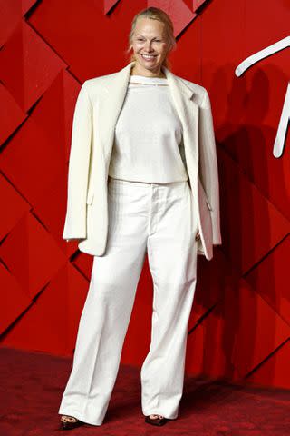 <p>Gareth Cattermole/Getty</p> A full view of Pamela Anderson's attire at The Fashion Awards 2023