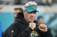 Jacksonville Jaguars head coach Doug Pederson walks the turf before an NFL wild-card football game between the Jacksonville Jaguars and the Los Angeles Chargers, Saturday, Jan. 14, 2023, in Jacksonville, Fla. (AP Photo/John Raoux)