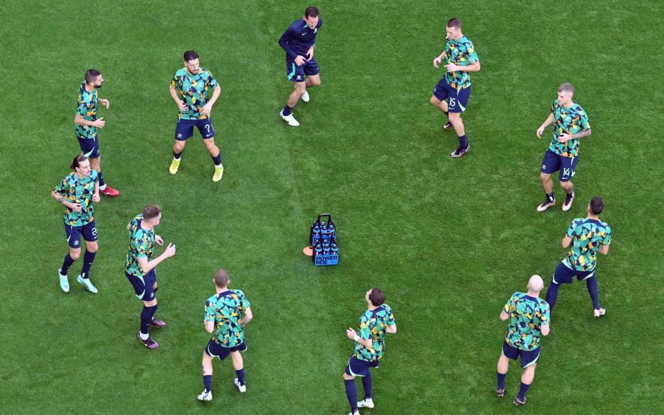 Australia players warm up ahead of the Qatar 2022 World Cup Group D football match between Tunisia and Australia at the Al-Janoub Stadium in Al-Wakrah, south of Doha on November 26, 2022 - ANTONIN THUILLIER/AFP via Getty Images