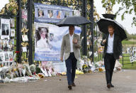 <p>On the 20th anniversary of their mother Diana’s death, the Duke of Cambridge and Prince Harry visited the White Garden in Kensington Palace, to meet with representatives from charities supported by the late Princess of Wales, and look at floral tributes. (PA) </p>