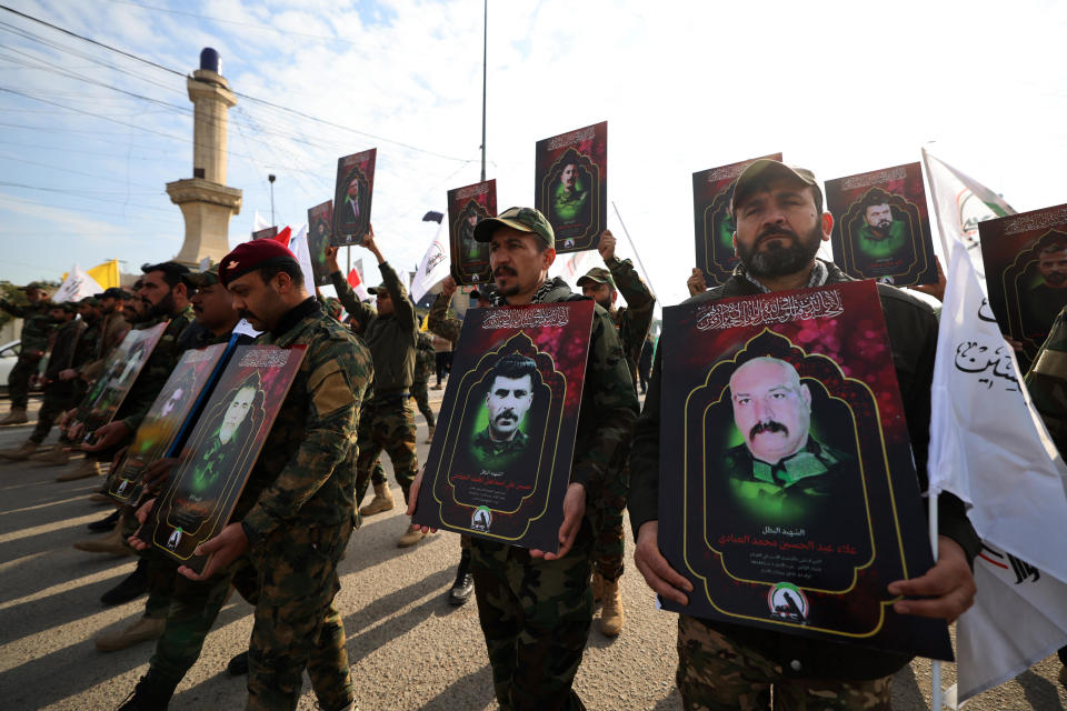 Members of Iraq's Iran-backed Hashed al-Shaabi (Popular Mobilization) paramilitary forces, carry portraits of people  killed the previous day in U.S. strikes in western Iraq, ahead of their funeral procession in Baghdad, Jan. 4, 2024. / Credit: AHMAD AL-RUBAYE/AFP/Getty