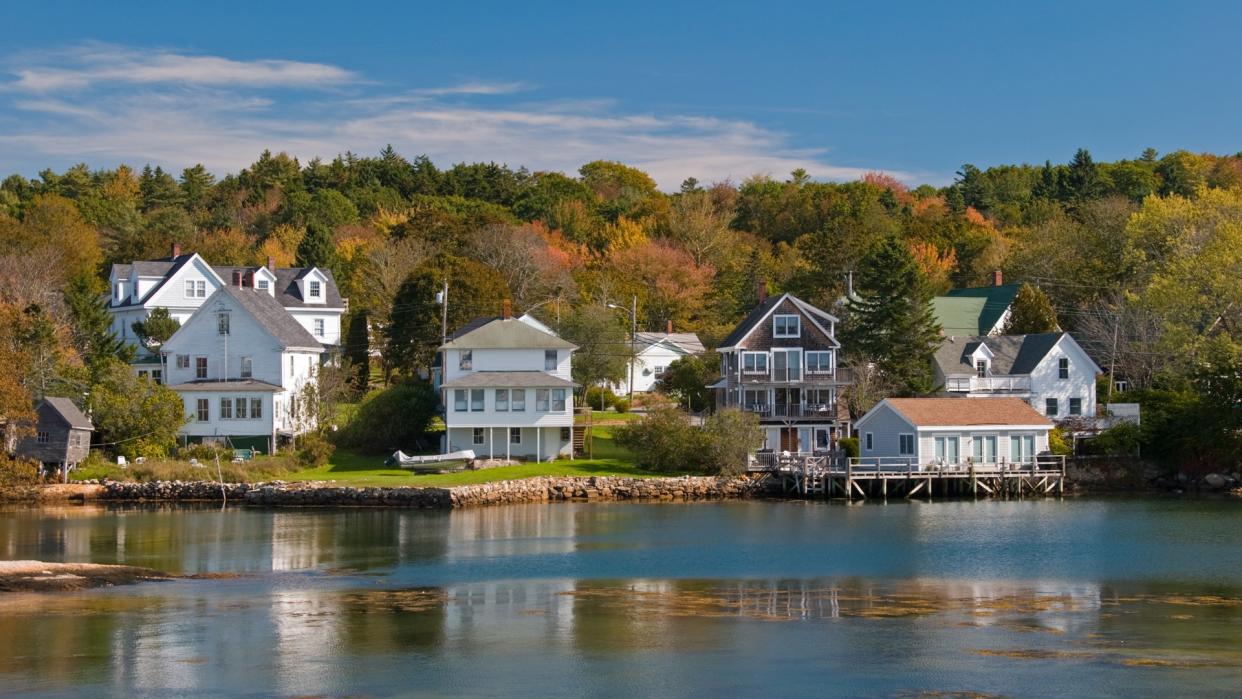 Victorian houses in a fall foliage setting in New England.