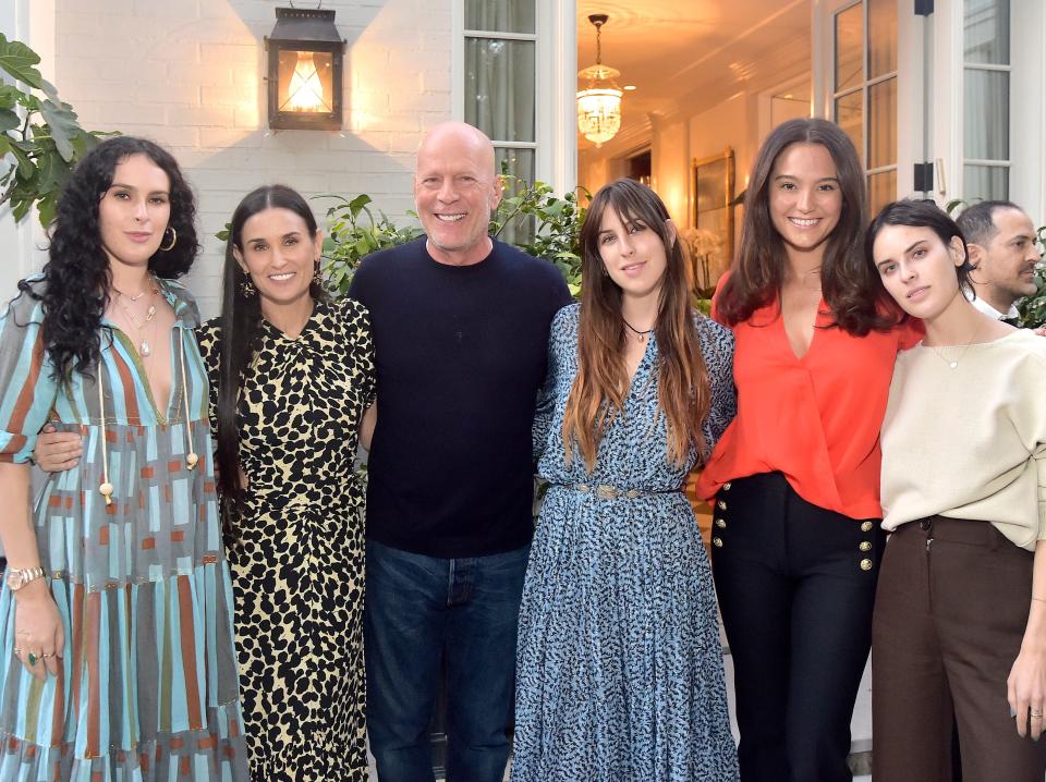 Rumer Willis, Demi Moore, Bruce Willis, Scout Willis, Emma Heming Willis, and Tallulah Willis pose for photos at a 2019 event.