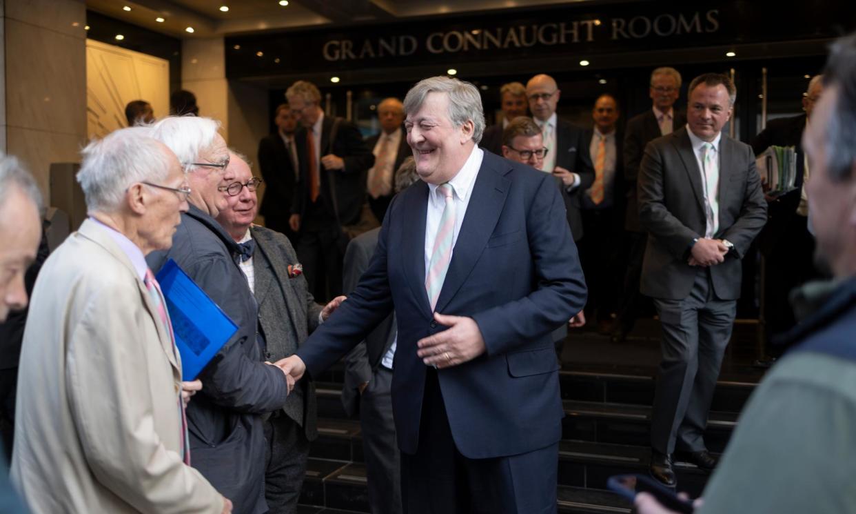 <span>Garrick Club member Stephen Fry shakes hands with a well-wisher after the vote to allow women to join.</span><span>Photograph: Graeme Robertson/The Guardian</span>