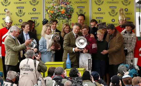 Horse Racing - Crabbie's Grand National Festival - Aintree Racecourse - 9/4/16 Jockey David Mullins celebrates winning with the Crabbie's Grand National trophy Action Images via Reuters / Jason Cairnduff Livepic